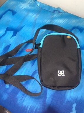 Sherpani Black Rogue Crossbody Bag with Teal Trim